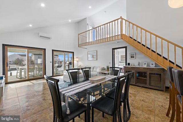 dining room with a wall mounted air conditioner and high vaulted ceiling