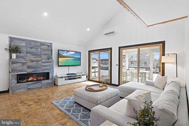 living room featuring a wall mounted air conditioner, tile patterned floors, a fireplace, and high vaulted ceiling