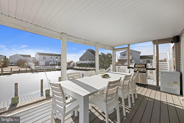 snow covered deck featuring a grill