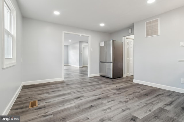 unfurnished room featuring light hardwood / wood-style flooring