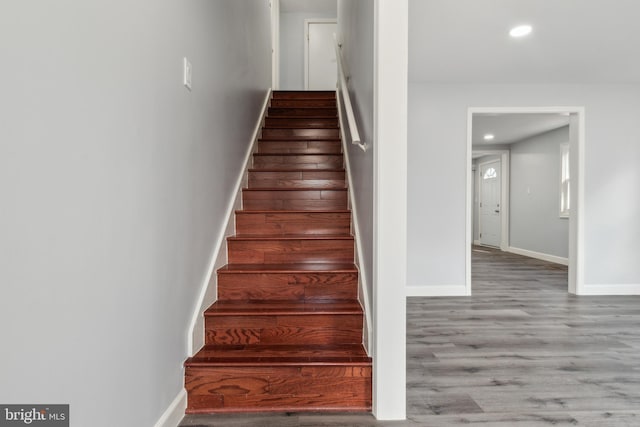 stairs with wood-type flooring