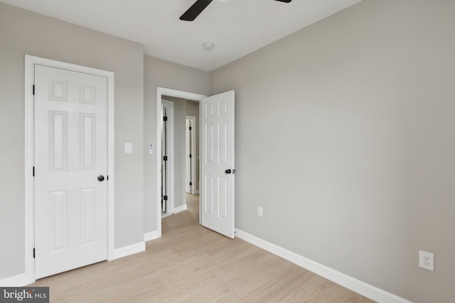 unfurnished bedroom featuring ceiling fan and light hardwood / wood-style flooring