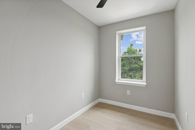 unfurnished room with ceiling fan and light wood-type flooring