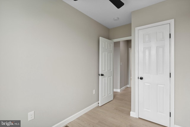 unfurnished bedroom featuring ceiling fan and light hardwood / wood-style floors