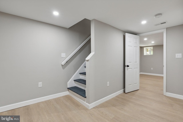 basement featuring light hardwood / wood-style floors