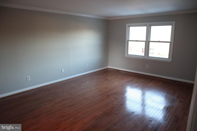 unfurnished room featuring crown molding and dark hardwood / wood-style floors