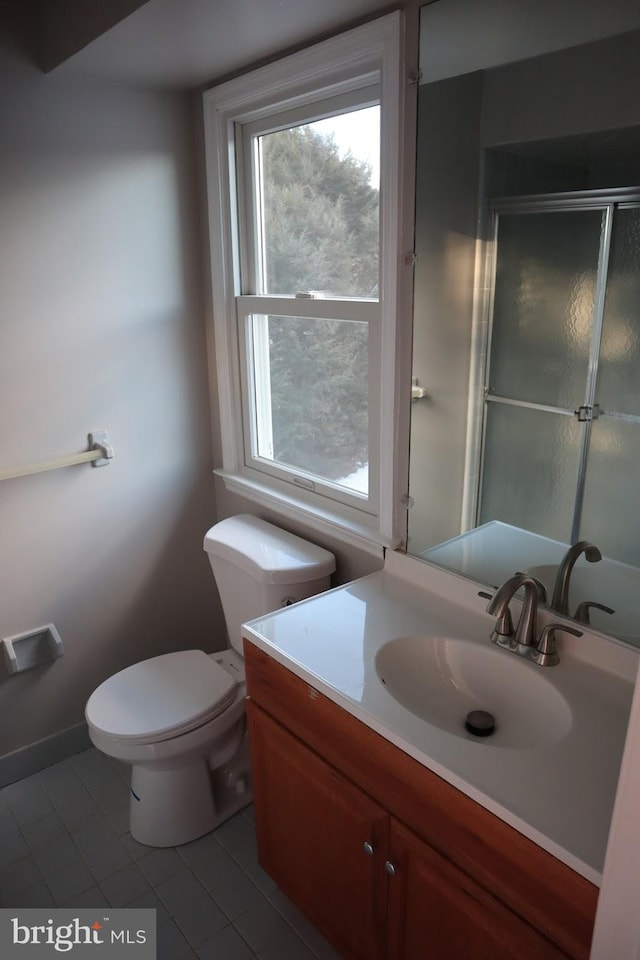 bathroom with vanity, an enclosed shower, tile patterned floors, and toilet