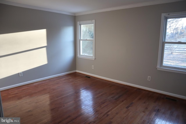 unfurnished room with dark hardwood / wood-style flooring and ornamental molding