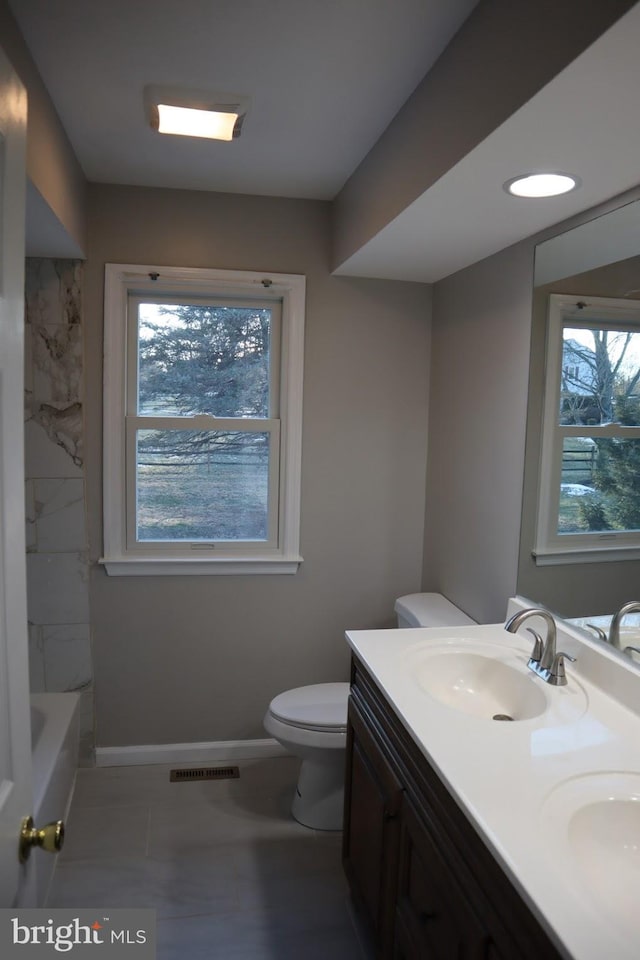 bathroom featuring vanity and toilet