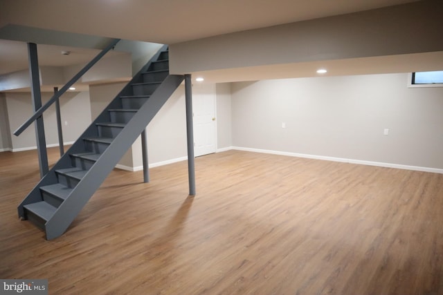 basement featuring hardwood / wood-style floors