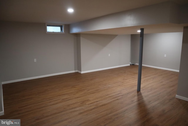 basement with dark wood-type flooring