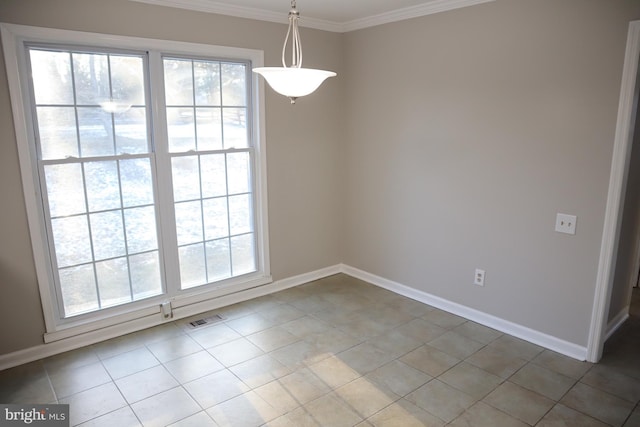 unfurnished dining area featuring tile patterned floors and ornamental molding