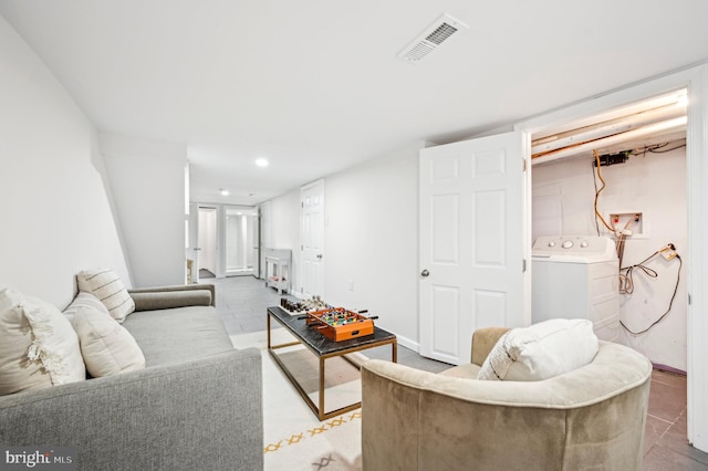 living room with washer / clothes dryer