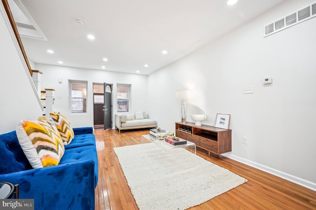 living room with light hardwood / wood-style floors