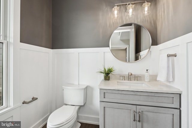 bathroom featuring vanity and toilet