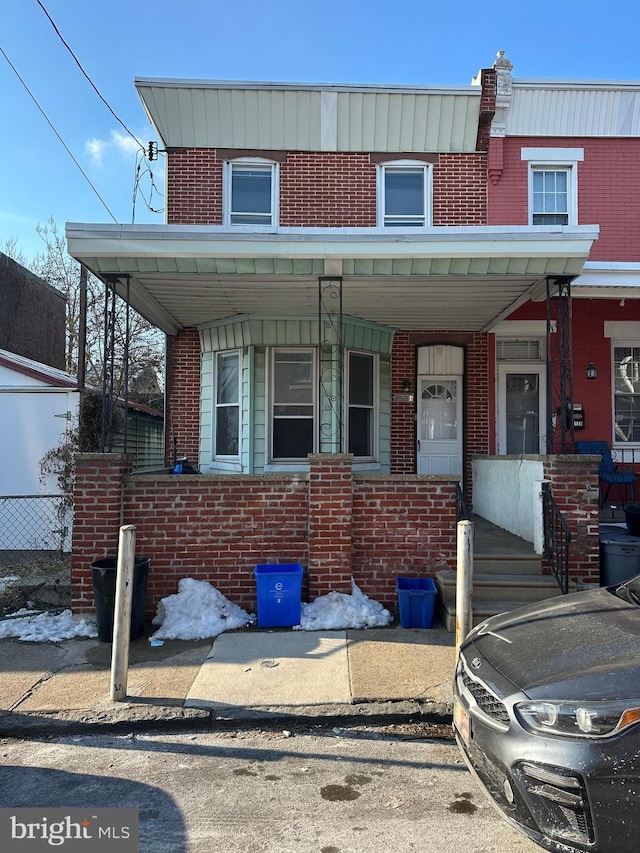 view of property with covered porch