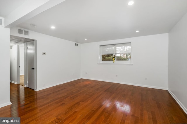 unfurnished room featuring dark hardwood / wood-style flooring