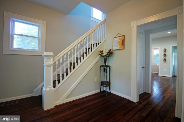 stairs featuring hardwood / wood-style flooring