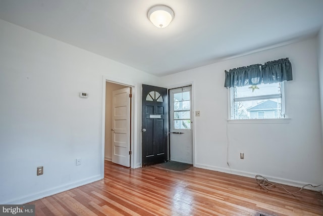 spare room with wood-type flooring