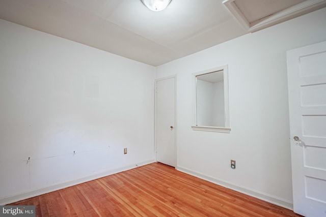 unfurnished room featuring hardwood / wood-style flooring