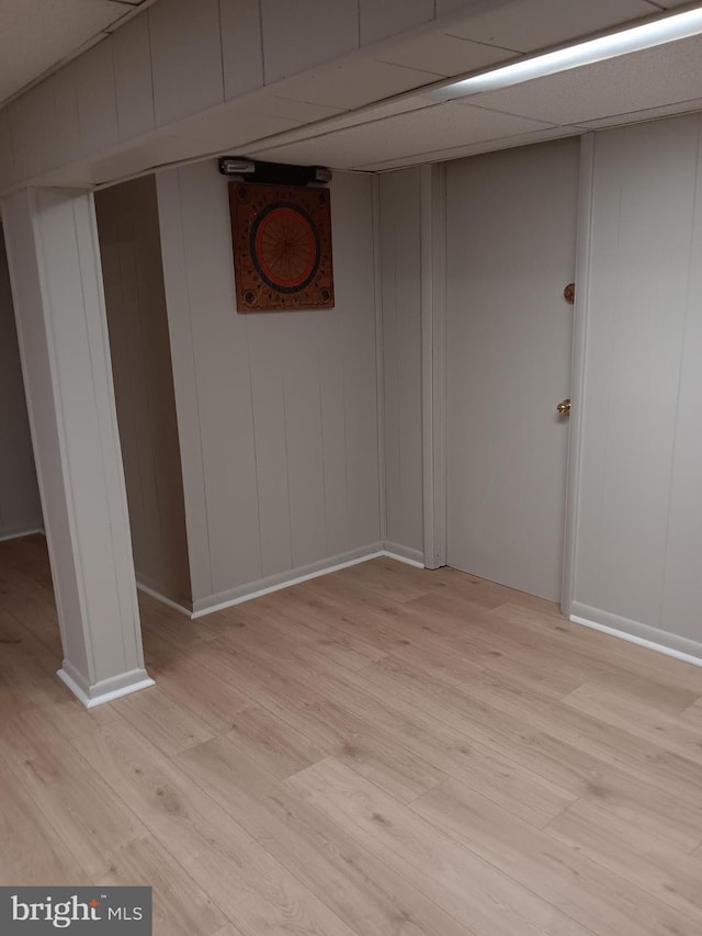 basement featuring light hardwood / wood-style floors