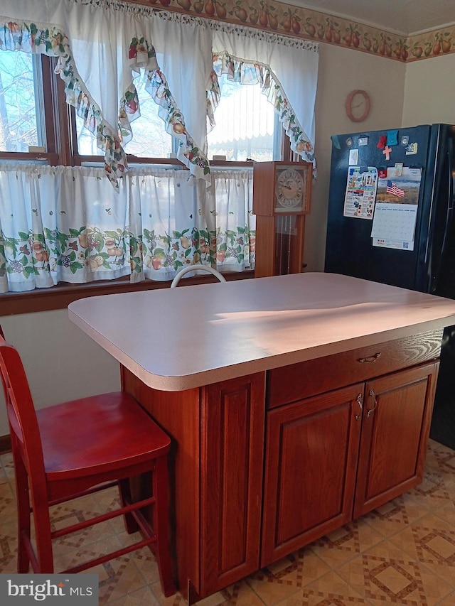 kitchen with black fridge