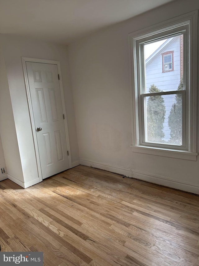 unfurnished room featuring light hardwood / wood-style flooring