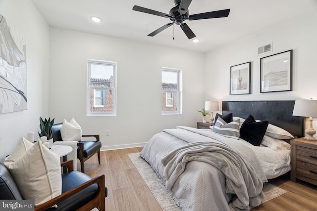 bedroom featuring ceiling fan and light hardwood / wood-style floors