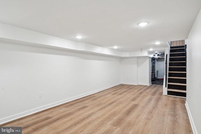 basement featuring light wood-type flooring