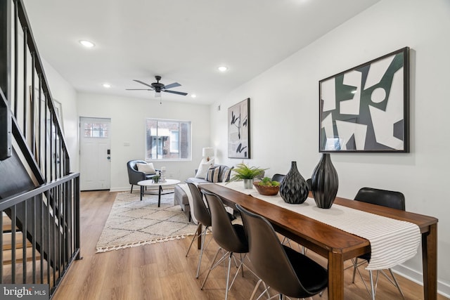 dining area featuring ceiling fan and light hardwood / wood-style floors