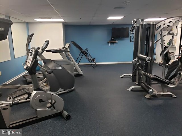 gym featuring a paneled ceiling