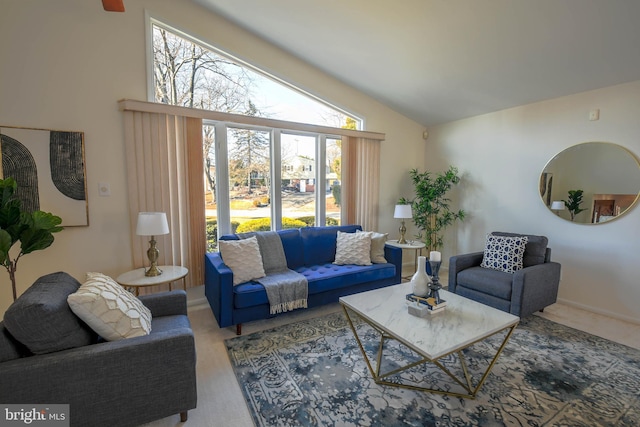 carpeted living room with vaulted ceiling