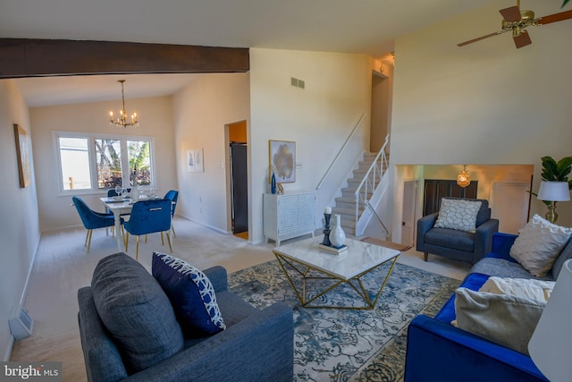 living room featuring ceiling fan with notable chandelier, lofted ceiling with beams, and light carpet