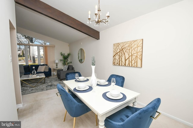 carpeted dining room featuring a notable chandelier and vaulted ceiling with beams