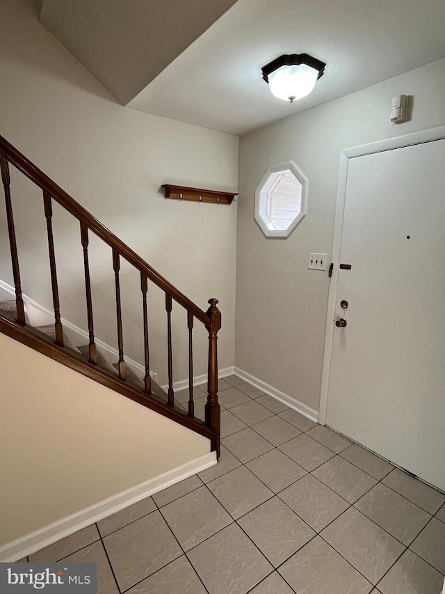 entryway featuring light tile patterned floors