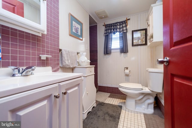 bathroom featuring tile patterned floors, toilet, and vanity