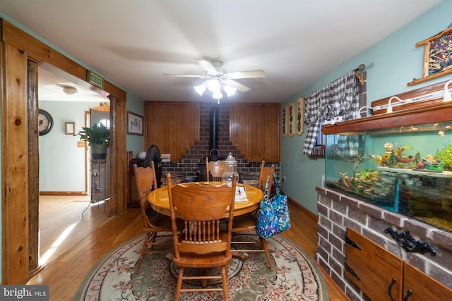 dining space featuring ceiling fan and light wood-type flooring