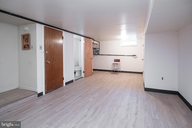 spare room featuring light hardwood / wood-style flooring