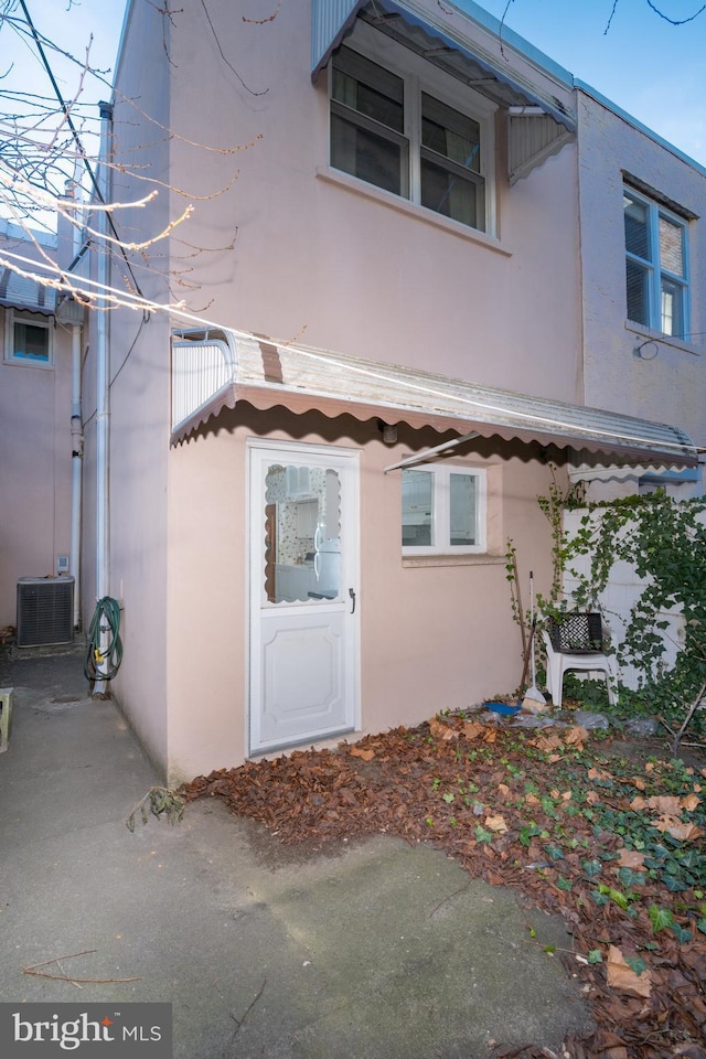 view of property exterior with cooling unit