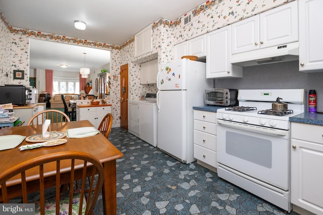 kitchen with white cabinetry, white appliances, and separate washer and dryer