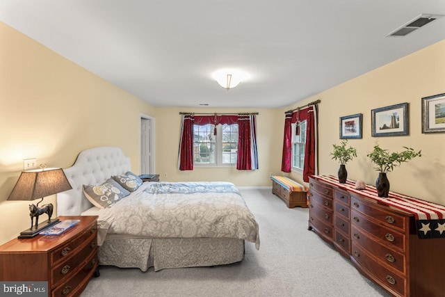 bedroom featuring light colored carpet