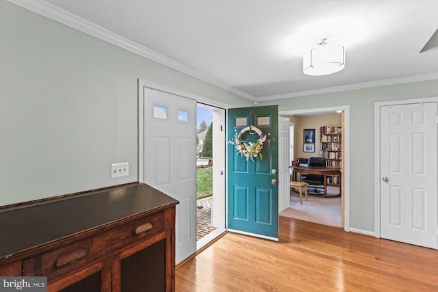 entryway with ornamental molding and light wood-type flooring