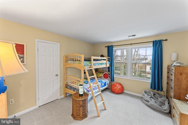 bedroom with light colored carpet