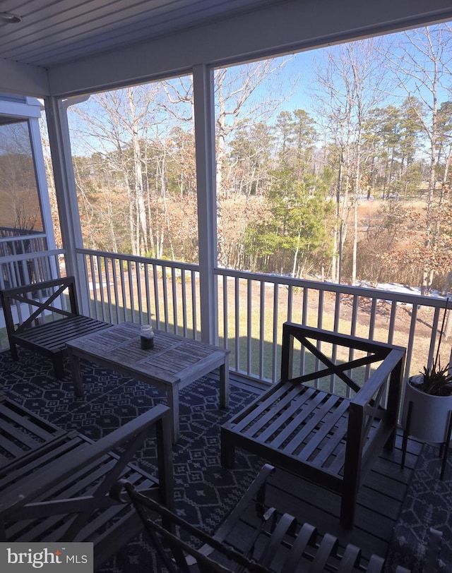 unfurnished sunroom with a wealth of natural light