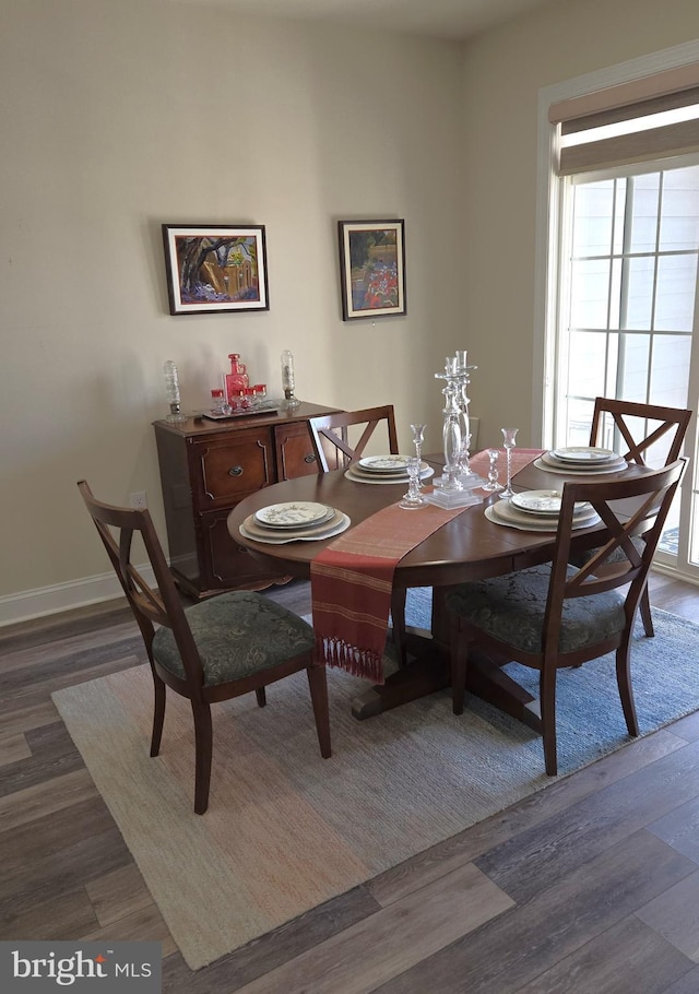 dining room with dark wood-type flooring