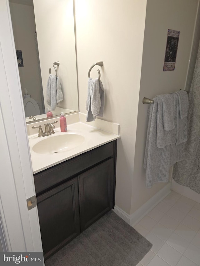 bathroom with vanity and tile patterned flooring