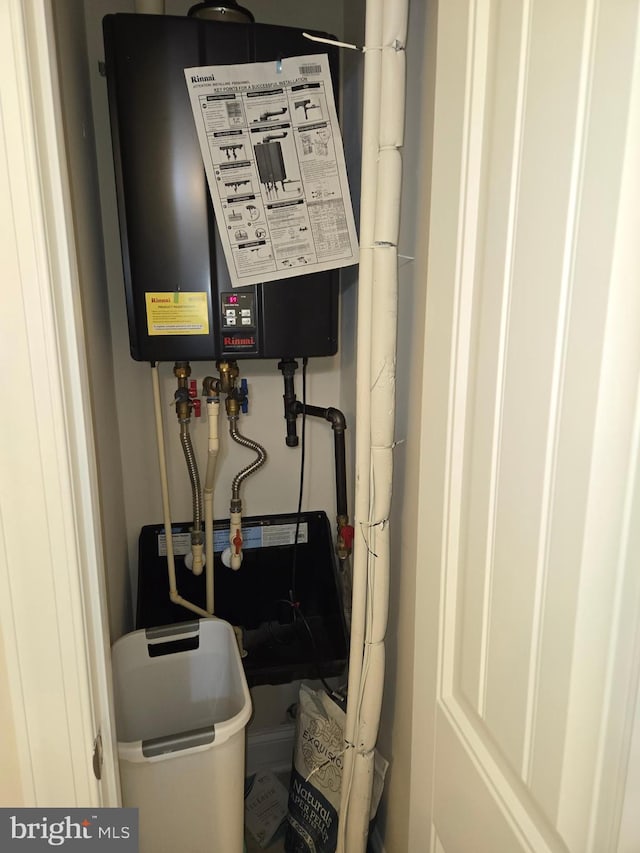 utility room with water heater