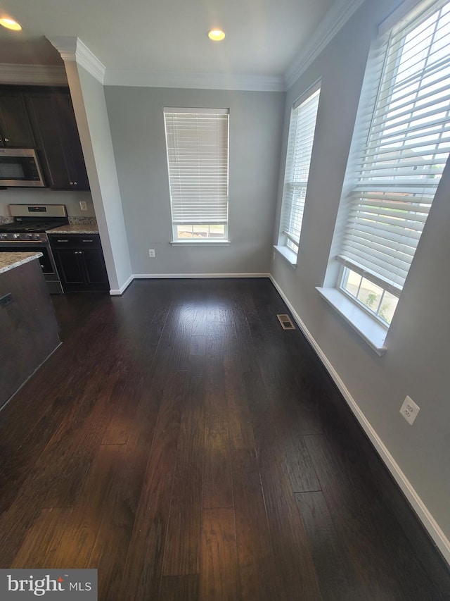 interior space featuring crown molding and dark wood-type flooring