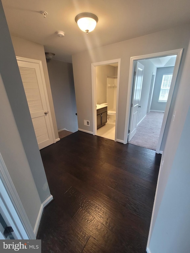 hallway featuring dark hardwood / wood-style floors