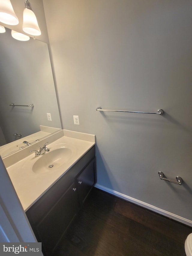 bathroom with vanity and hardwood / wood-style floors